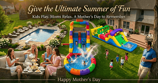Kids racing down a large, color-block inflatable water slide in a sunny backyard, with a relaxed mom. Mother's Day backyard gift idea.
